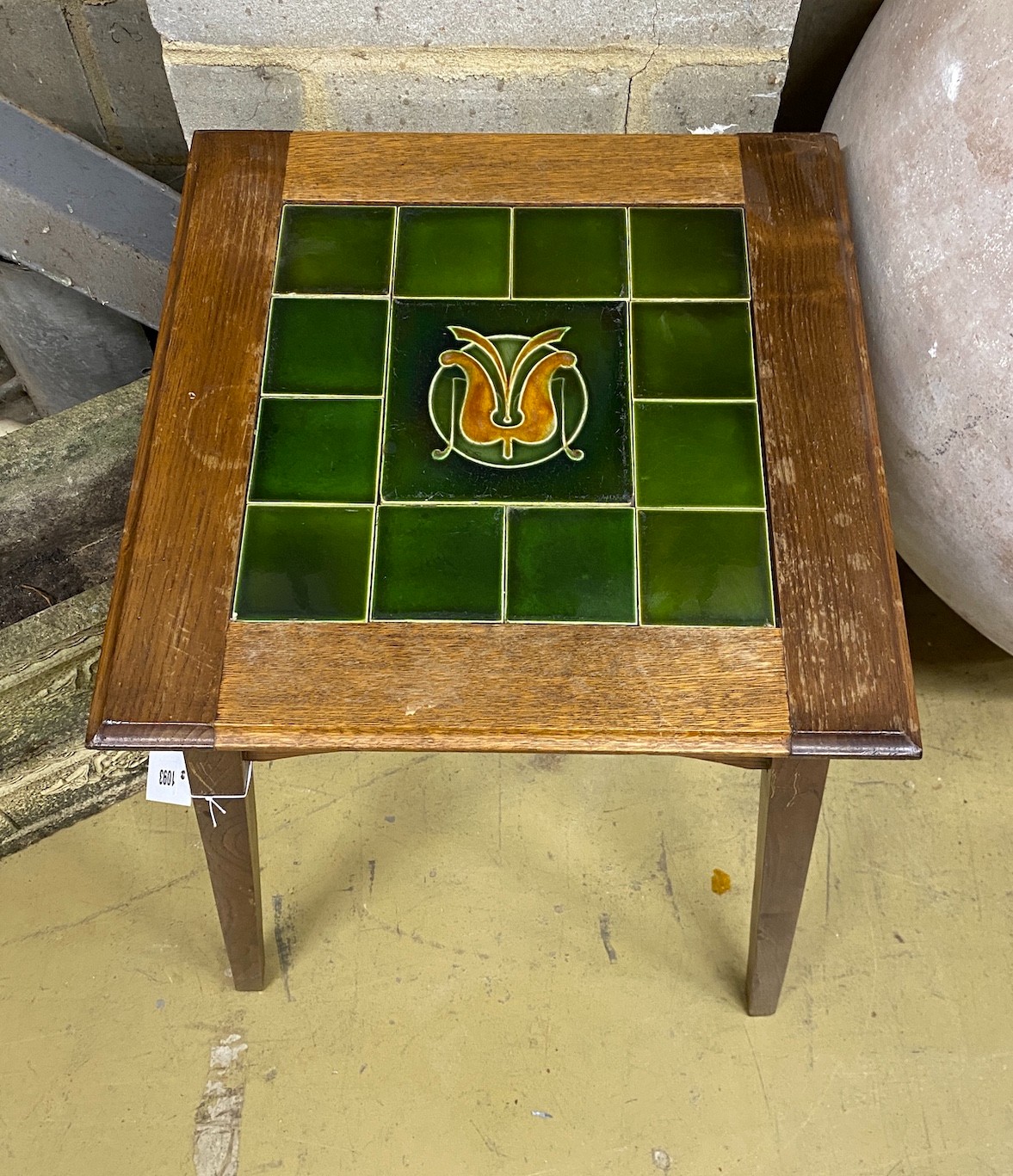 An Edwardian tile top occasional table, width 45cm, height 66cm